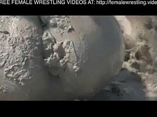 Girls wrestling here the mud